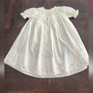 Yellow smocked dress with flowers